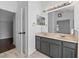Bathroom features double vanity with a door leading to another room at 119 Argyle Gate Loop Rd, Dundee, FL 33838