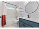 Bathroom with shower-tub combo, sleek vanity, and modern fixtures at 119 Argyle Gate Loop Rd, Dundee, FL 33838