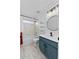 Bathroom with shower-tub combo, sleek vanity, and modern lighting at 119 Argyle Gate Loop Rd, Dundee, FL 33838