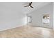 Bright bedroom with vaulted ceilings, tile flooring, and abundant natural light from two windows at 119 Argyle Gate Loop Rd, Dundee, FL 33838