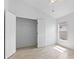 Bedroom features wood-look tile flooring and a closet with ample storage space at 119 Argyle Gate Loop Rd, Dundee, FL 33838