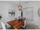 Formal dining room with wood table, decor, light fixture, and bright light at 119 Argyle Gate Loop Rd, Dundee, FL 33838
