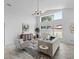 Bright living room with vaulted ceiling, modern decor, and natural light at 119 Argyle Gate Loop Rd, Dundee, FL 33838