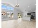 Open living space with wood-look floors, modern lighting, and a contemporary kitchen with stainless steel appliances at 119 Argyle Gate Loop Rd, Dundee, FL 33838