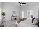 Spacious bedroom featuring ample natural light, ceiling fan, walk in closet, and ensuite bathroom at 119 Argyle Gate Loop Rd, Dundee, FL 33838
