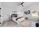 Spacious bedroom featuring ample natural light, ceiling fan, walk in closet, and ensuite bathroom at 119 Argyle Gate Loop Rd, Dundee, FL 33838