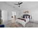 Spacious bedroom featuring ample natural light, ceiling fan, walk in closet, and ensuite bathroom at 119 Argyle Gate Loop Rd, Dundee, FL 33838