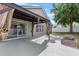 Outdoor patio featuring a covered area, sliding glass doors, and a backyard with a fire pit at 119 Argyle Gate Loop Rd, Dundee, FL 33838