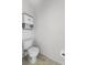 Image shows toilet with cabinet above, plus modern fixtures at 119 Argyle Gate Loop Rd, Dundee, FL 33838