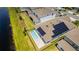 The home has solar panels on the roof, a pool, and a fenced in backyard at 13864 Destin Beach Ln, Orlando, FL 32827
