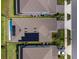 Aerial view of homes and neighborhood highlighting the roof, pool and greenery at 13864 Destin Beach Ln, Orlando, FL 32827
