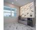 Modern bar area with built-in wine rack and cooler, enhanced by marble floors and natural light at 13864 Destin Beach Ln, Orlando, FL 32827