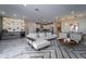 Bright, modern living room featuring an open floor plan, stylish decor, and luxury marble floors at 13864 Destin Beach Ln, Orlando, FL 32827