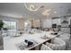 Bright, open-concept living space with modern decor, dining area, and kitchen at 13864 Destin Beach Ln, Orlando, FL 32827