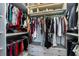 Organized walk-in closet with ample storage, built-in shelving, and custom lighting for easy access to wardrobe at 13864 Destin Beach Ln, Orlando, FL 32827