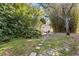A lush backyard retreat with stepping stones leading to a serene patio area at 14841 Faversham Cir, Orlando, FL 32826