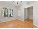 Cozy bedroom with hardwood floors, ample natural light, and neutral wall color at 14841 Faversham Cir, Orlando, FL 32826