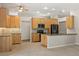 Spacious kitchen with stainless steel appliances, stone backsplash, and wood cabinets at 14841 Faversham Cir, Orlando, FL 32826