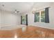 Bright living area with hardwood and carpet flooring, featuring access to an outdoor patio at 14841 Faversham Cir, Orlando, FL 32826