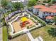 Aerial view of community playground, mini golf, and Gathering recreation area at 16604 Caribbean Breeze Way, Clermont, FL 34714