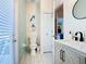 Bright bathroom featuring a stylish vanity, coastal decor, and plenty of natural light at 16604 Caribbean Breeze Way, Clermont, FL 34714