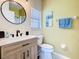 Bathroom featuring a stylish vanity, modern fixtures, and neutral wall paint at 16604 Caribbean Breeze Way, Clermont, FL 34714