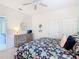 Comfortable bedroom features closet space and floral bedding at 16604 Caribbean Breeze Way, Clermont, FL 34714