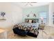 Cozy bedroom with floral bedding, ceiling fan, and ample closet space at 16604 Caribbean Breeze Way, Clermont, FL 34714