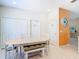Bright dining area with seating and a view into other living spaces at 16604 Caribbean Breeze Way, Clermont, FL 34714