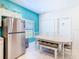 The eat-in kitchen features a refrigerator and seating for four at 16604 Caribbean Breeze Way, Clermont, FL 34714