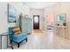 Welcoming foyer with light wood-look floors, leading to a bedroom and an arched front door at 16604 Caribbean Breeze Way, Clermont, FL 34714