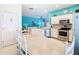 Open concept kitchen with stainless steel appliances and an adjacent dining area at 16604 Caribbean Breeze Way, Clermont, FL 34714