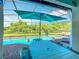 Enclosed patio with a pool, hot tub, and seating area for relaxation and outdoor enjoyment at 16604 Caribbean Breeze Way, Clermont, FL 34714