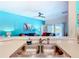 The kitchen features a double sink with modern fixtures and a view to the living area at 16604 Caribbean Breeze Way, Clermont, FL 34714