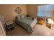Bright bedroom with a full bed and window letting in natural light, creating a relaxing atmosphere at 170 Palmetto Woods Ct # 1A, Deltona, FL 32725