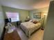 Bedroom with neutral colors, window, and a double bed at 170 Palmetto Woods Ct # 1A, Deltona, FL 32725