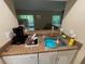 Kitchen sink with granite countertops and view of living room and outdoor patio at 170 Palmetto Woods Ct # 1A, Deltona, FL 32725
