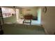 Living room area featuring tiled floors, sofa, and open access to the kitchen at 170 Palmetto Woods Ct # 1A, Deltona, FL 32725