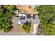 Aerial view of property showing roof, solar panels, mature trees, and lot layout at 17409 Division St, Montverde, FL 34756
