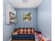 Cozy bedroom area with a small window and a built-in bookcase at 17409 Division St, Montverde, FL 34756