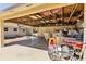 Spacious carport provides covered parking and storage, with an American flag hanging above at 17409 Division St, Montverde, FL 34756