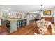 Open-concept kitchen with a large island, modern appliances, and hardwood floors at 17409 Division St, Montverde, FL 34756