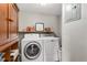 Functional laundry room equipped with modern appliances and built-in storage at 17409 Division St, Montverde, FL 34756