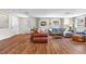 Comfortable living room featuring hardwood floors, ample seating, and plenty of natural light at 17409 Division St, Montverde, FL 34756