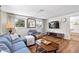 Comfortable living room with cozy seating, wood floors, and lots of natural light at 17409 Division St, Montverde, FL 34756