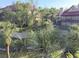 Lush greenery surrounds this two-story residential building with palms, lawn, and mature trees at 208 Afton Sq # 307, Altamonte Springs, FL 32714