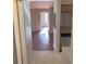 This shows the flow of the kitchen, highlighted by a granite countertop, into a living room featuring wood-look floors at 208 Afton Sq # 307, Altamonte Springs, FL 32714