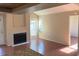 Bright living room featuring a fireplace and large windows that flood the space with natural light and wood flooring at 208 Afton Sq # 307, Altamonte Springs, FL 32714
