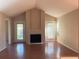 Bright living room features a cozy fireplace, patio access and wood floors at 208 Afton Sq # 307, Altamonte Springs, FL 32714