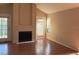 Spacious living room featuring a fireplace, wood floors, and natural light from the balcony access at 208 Afton Sq # 307, Altamonte Springs, FL 32714